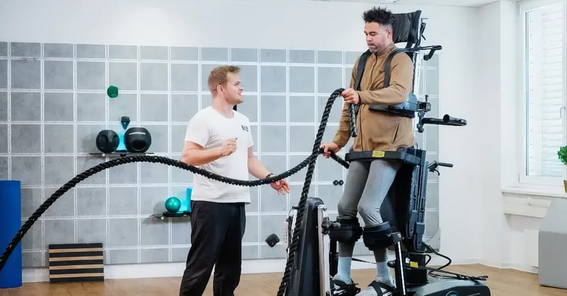 man training with his physiotherapist in the new innowalk pro
